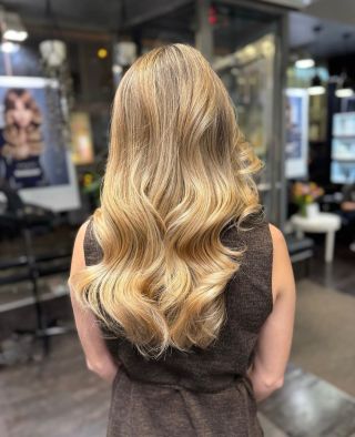 Previous warmth was neutralized through customized toning and soft root blending, creating a seamless gradient from depth...